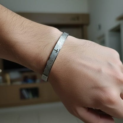 Silver bracelet on a wrist