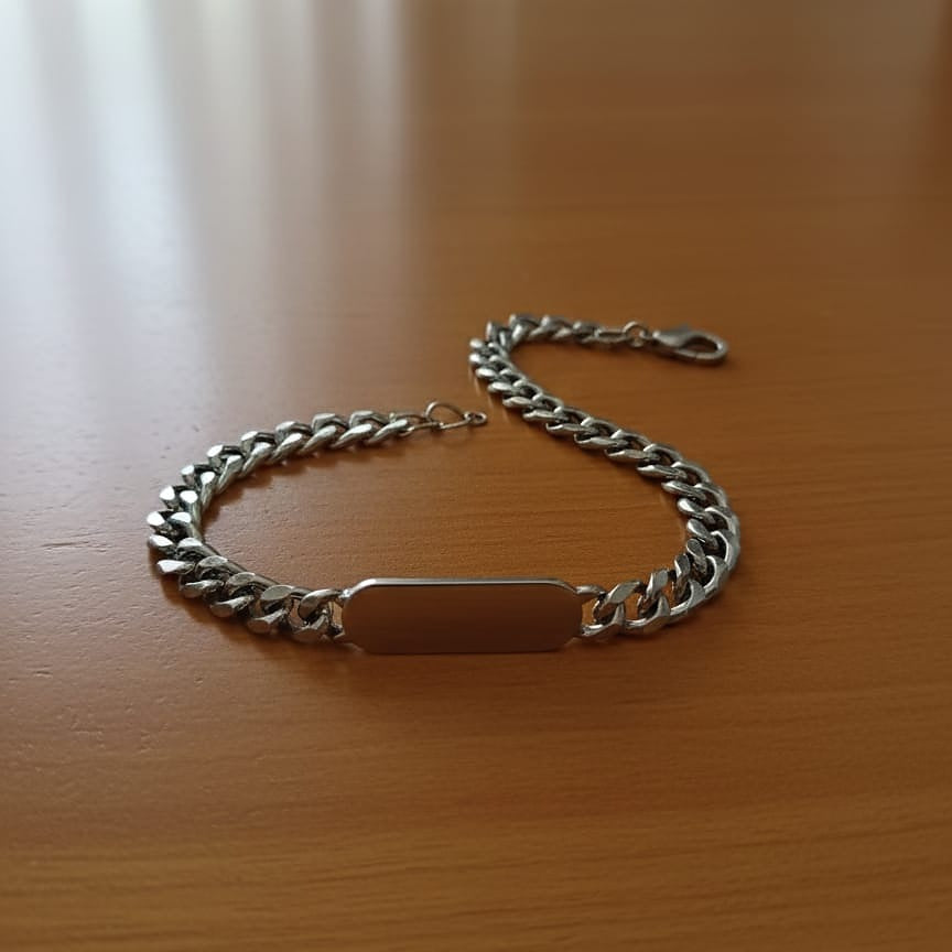 Silver chain bracelet with a rectangular tag 