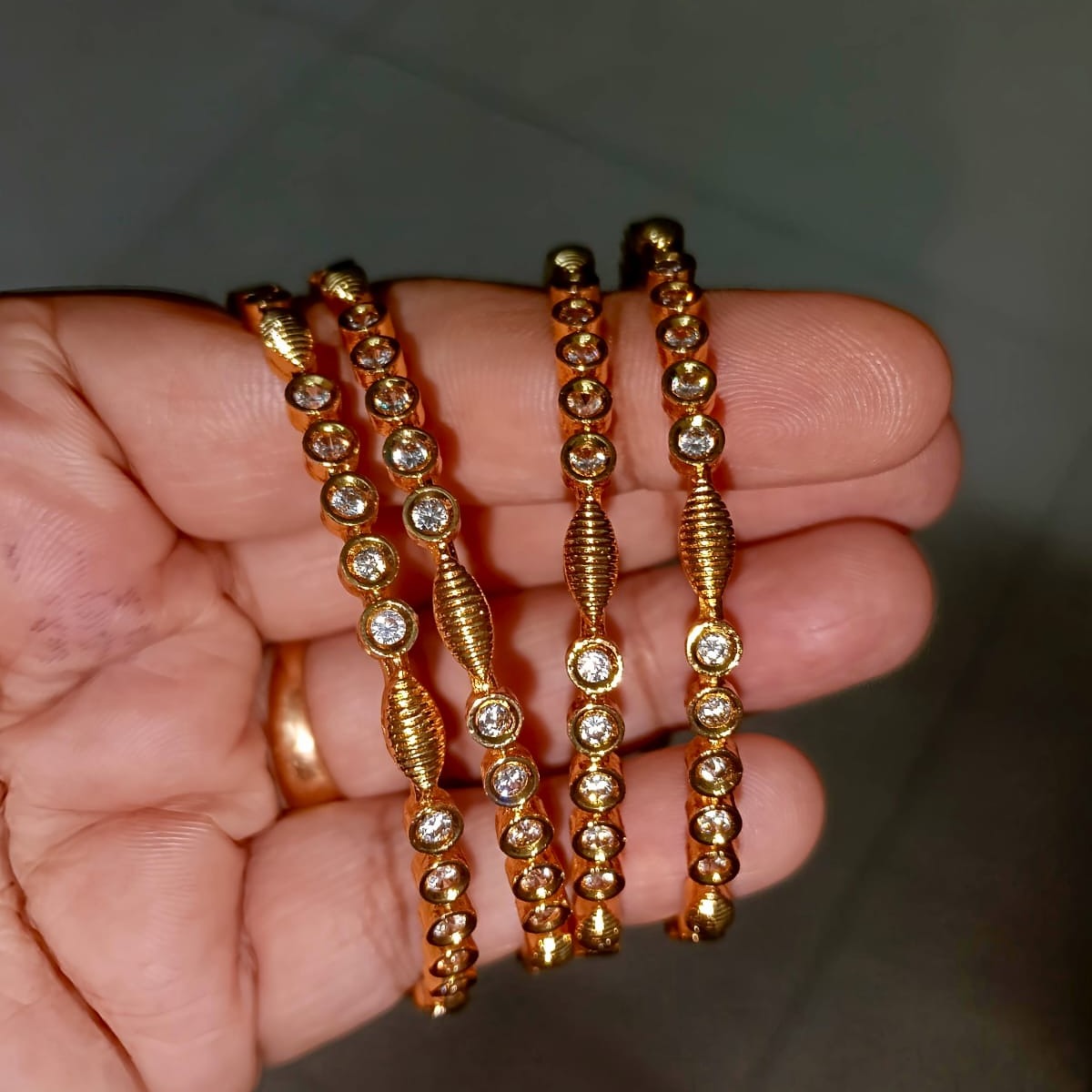 Traditional Gold-Toned Textured Bangle Set with Clear CZ Accents