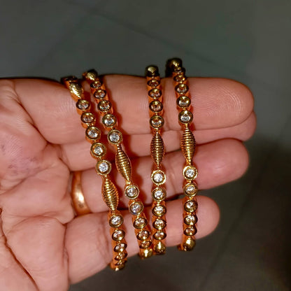 Traditional Gold-Toned Textured Bangle Set with Clear CZ Accents