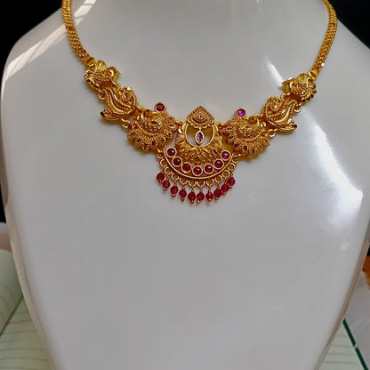 Gold necklace with red stones