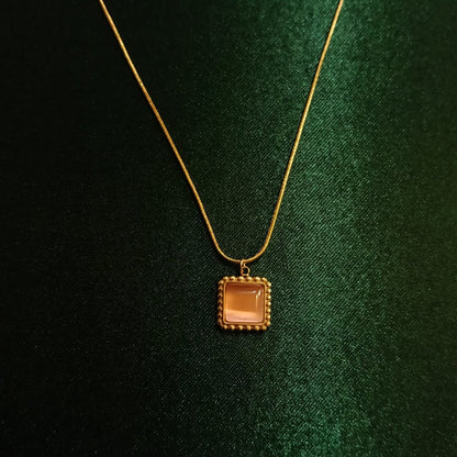 Gold necklace with a square pendant  