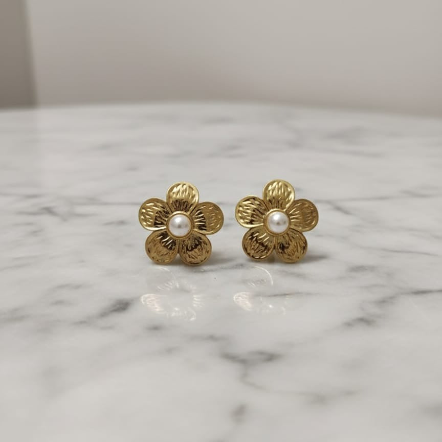Gold flower-shaped earrings with pearl centers