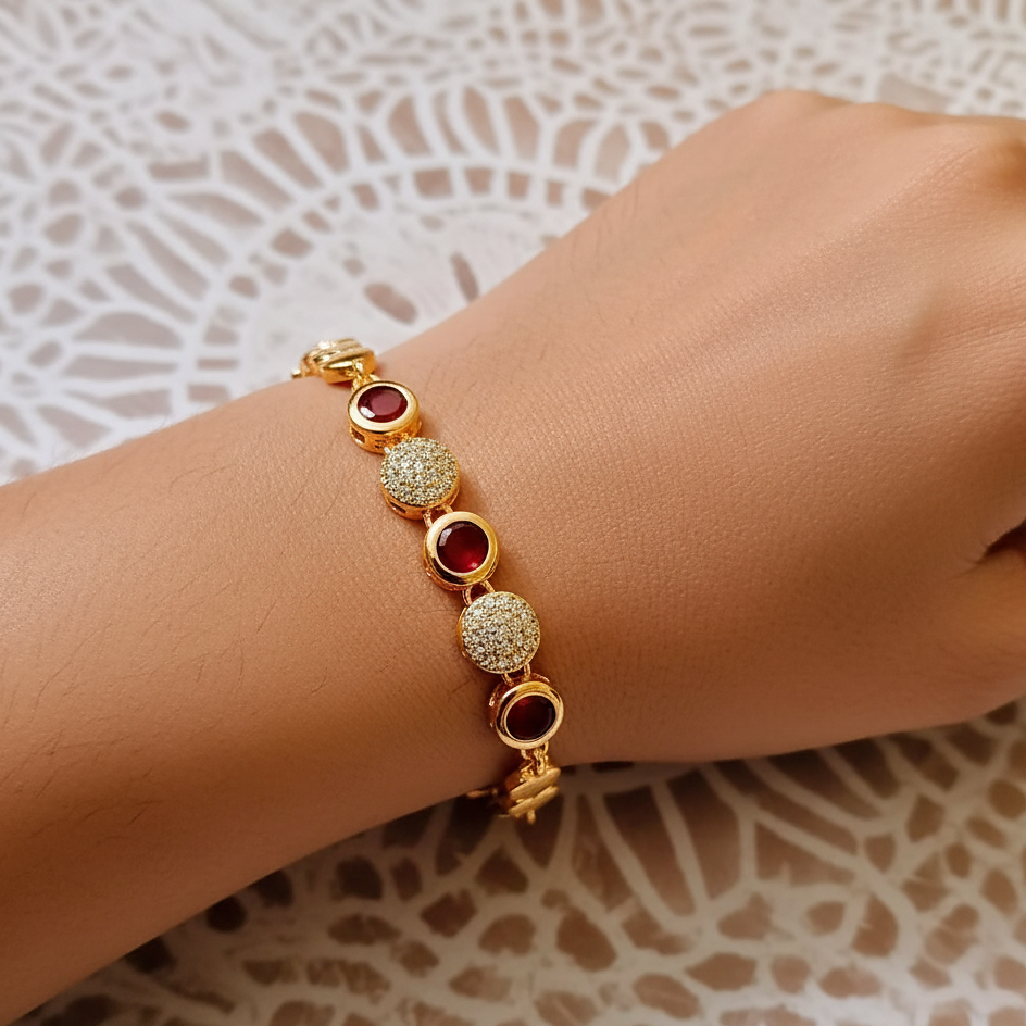 Gold bracelet with red gemstones 
